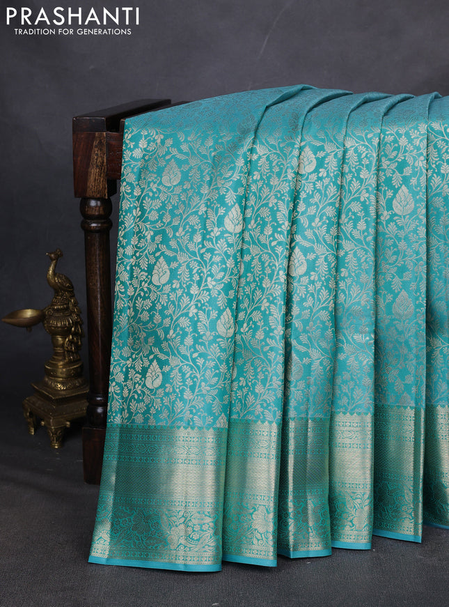 Pure kanchipuram silk saree teal blue with allover zari woven brocade weaves and zari woven border