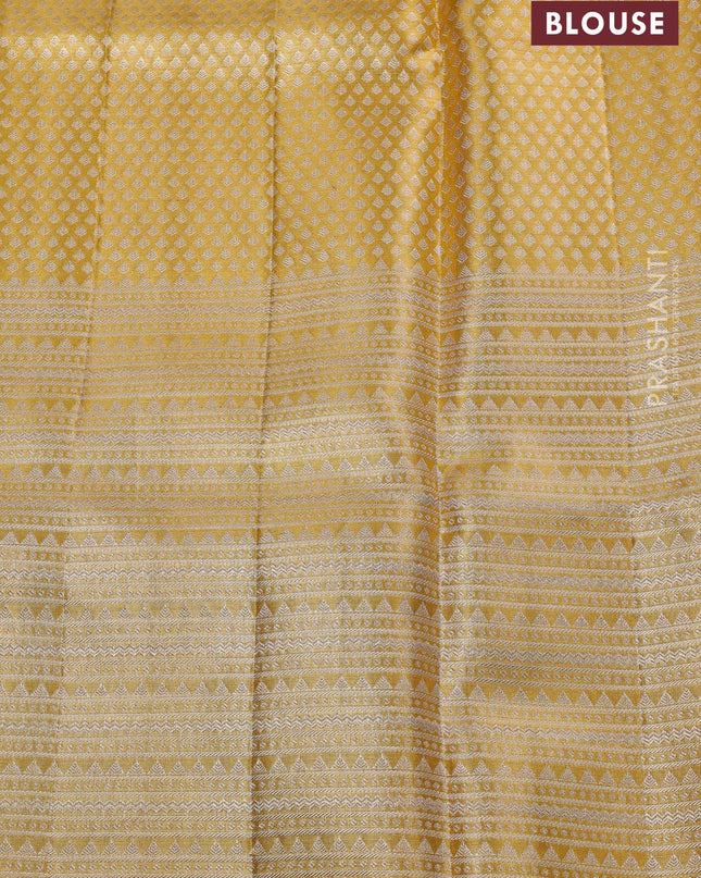 Pure kanchipuram silk saree gold and golden red with allover zari woven brocade weaves and long zari woven floral motif border