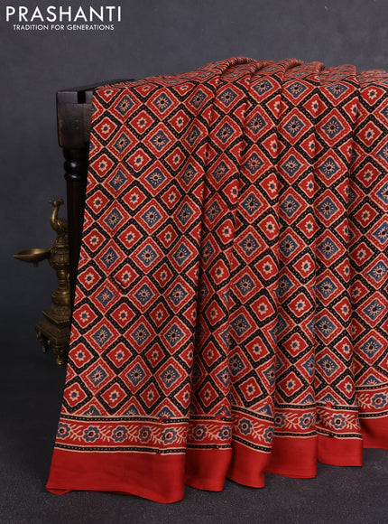 Modal silk Saree rustic orange with allover ajrakh butta prints and printed border