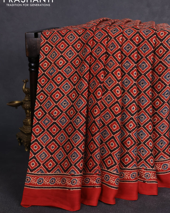 Modal silk Saree rustic orange with allover ajrakh butta prints and printed border