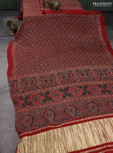 Modal silk Saree rustic orange with allover ajrakh butta prints and printed border