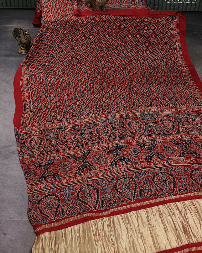 Modal silk Saree rustic orange with allover ajrakh butta prints and printed border