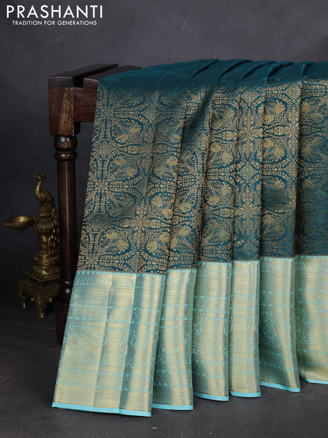Pure kanchipuram silk saree peacock green and light blue with allover zari woven brocade weaves and long zari woven border