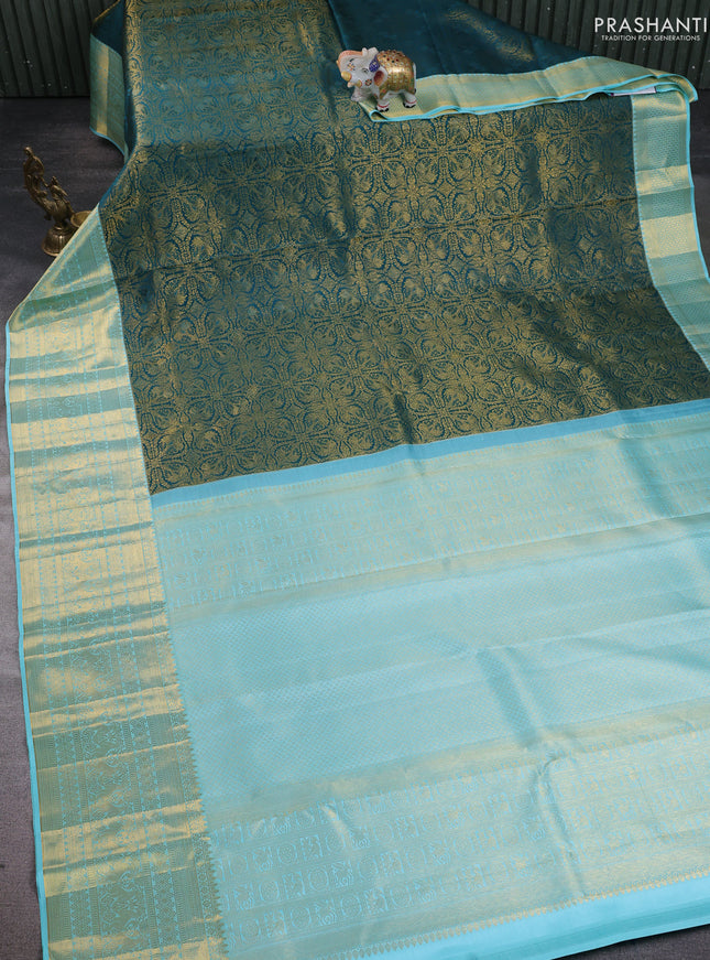 Pure kanchipuram silk saree peacock green and light blue with allover zari woven brocade weaves and long zari woven border