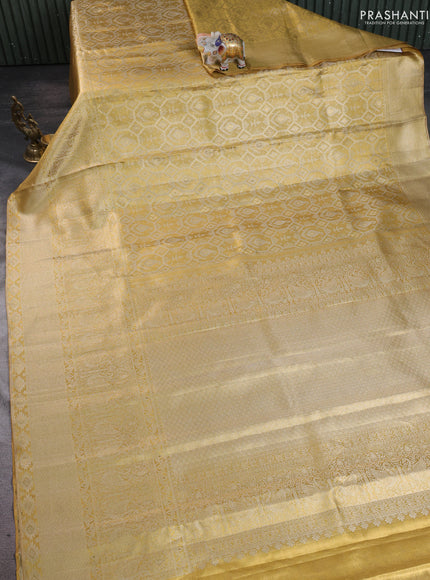 Pure kanchipuram tissue silk saree gold with allover zari woven brocade weaves and long zari woven border