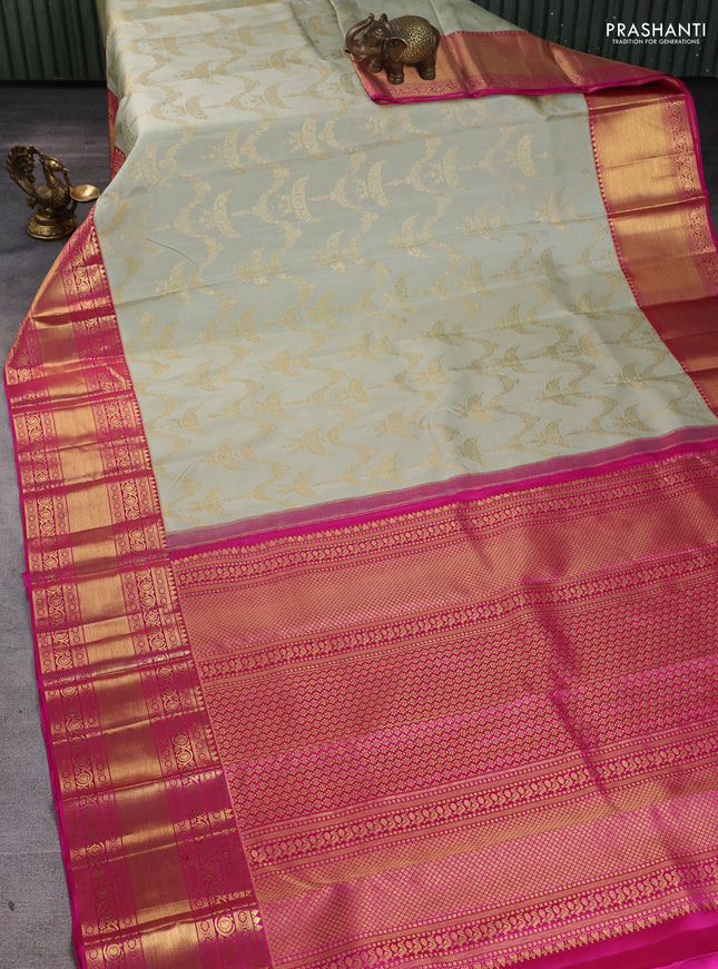 Pure kanchipuram silk saree pastel green and pink with allover zari woven brocade weaves and long zari woven border