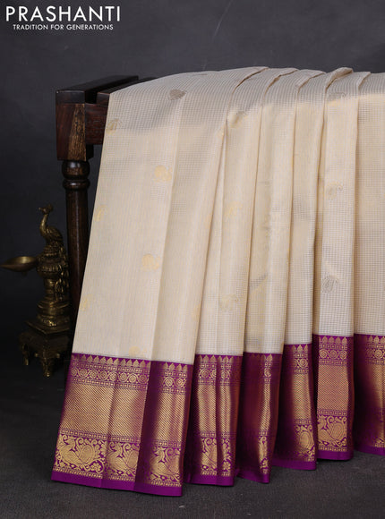 Pure kanchipuram silk saree cream and purple with allover zari checks & butta weaves and rich zari woven border