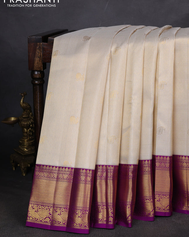 Pure kanchipuram silk saree cream and purple with allover zari checks & butta weaves and rich zari woven border