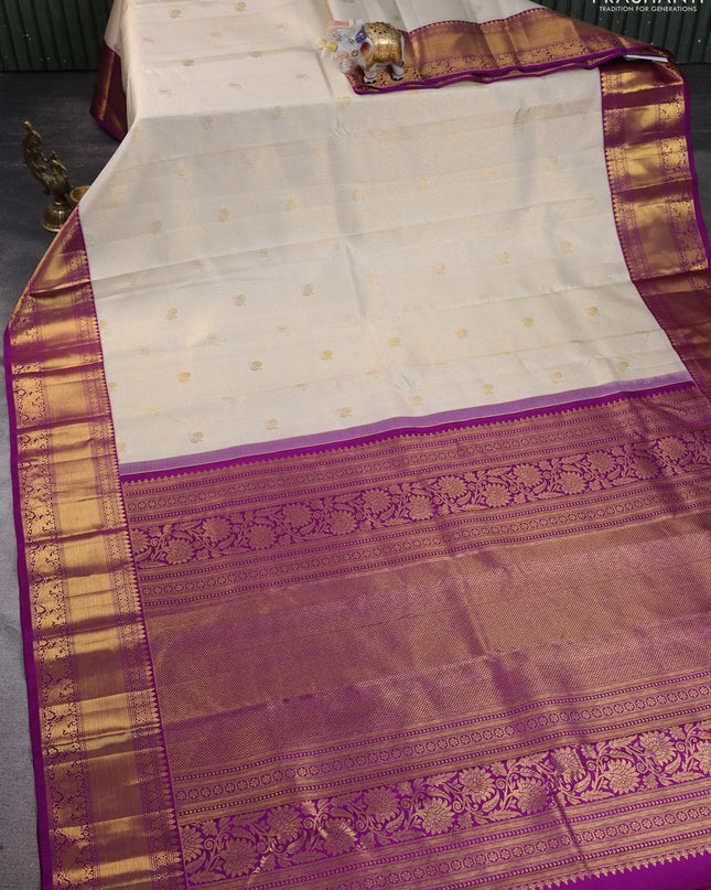 Pure kanchipuram silk saree cream and purple with allover zari checks & butta weaves and rich zari woven border