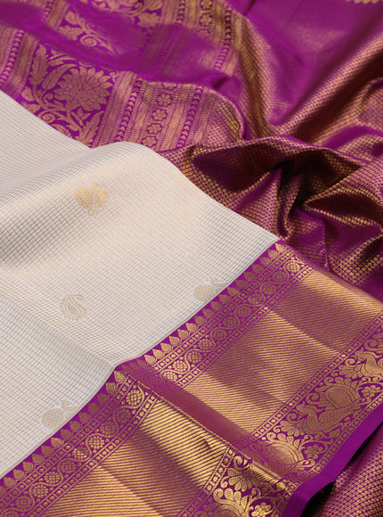 Pure kanchipuram silk saree cream and purple with allover zari checks & butta weaves and rich zari woven border