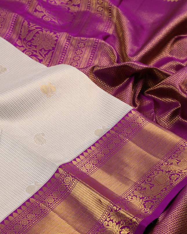 Pure kanchipuram silk saree cream and purple with allover zari checks & butta weaves and rich zari woven border