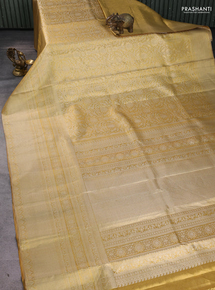 Pure kanchipuram tissue silk saree gold with allover zari woven brocade weaves and long zari woven border