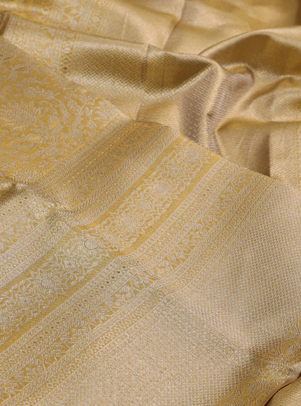 Pure kanchipuram tissue silk saree gold with allover zari woven brocade weaves and long zari woven border