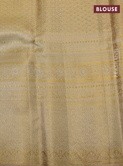 Pure kanchipuram tissue silk saree gold with allover zari woven brocade weaves and long zari woven border