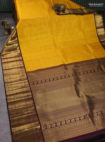 Pure kanchipuram silk saree yellow and coffee brown with allover zari checks & buttas and long zari woven border
