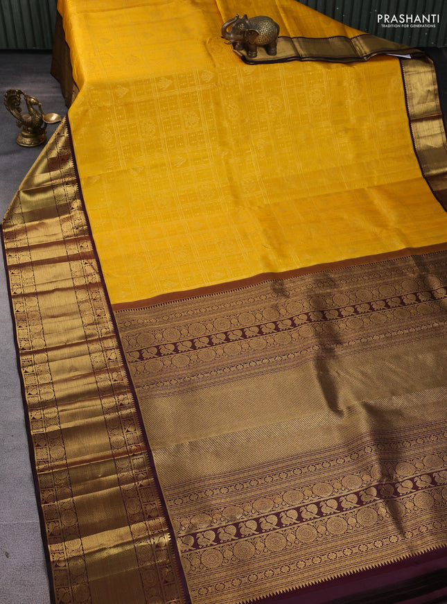 Pure kanchipuram silk saree yellow and coffee brown with allover zari checks & buttas and long zari woven border