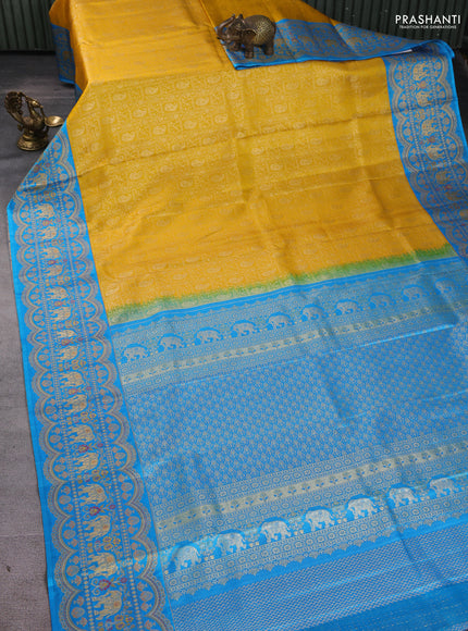 Pure kanchipuram silk saree yellow and cs blue with allover zari woven brocade weaves and long zari woven elephant border