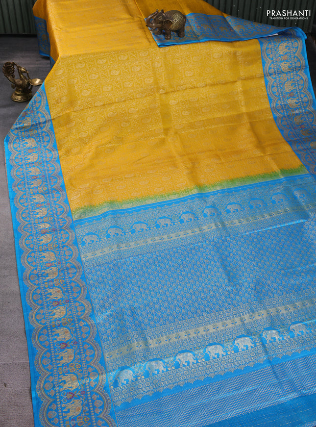 Pure kanchipuram silk saree yellow and cs blue with allover zari woven brocade weaves and long zari woven elephant border
