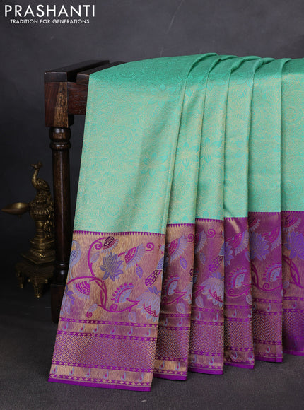Pure kanchipuram silk saree teal green and purple with allover zari woven brocade weaves and long zari woven paithani style border