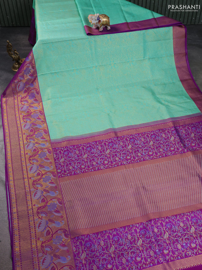 Pure kanchipuram silk saree teal green and purple with allover zari woven brocade weaves and long zari woven paithani style border
