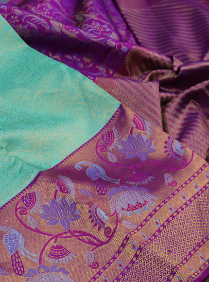 Pure kanchipuram silk saree teal green and purple with allover zari woven brocade weaves and long zari woven paithani style border