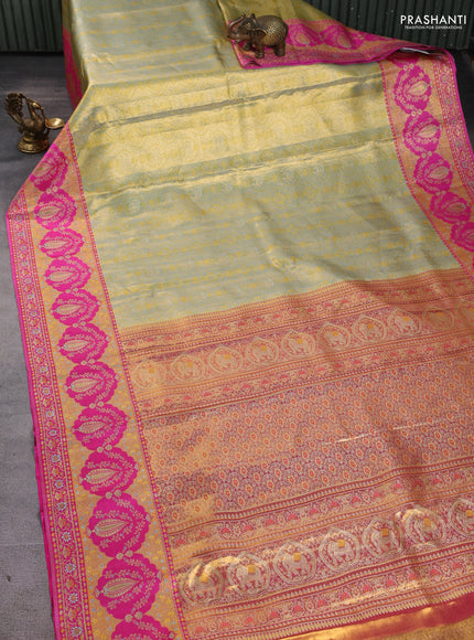 Pure kanchipuram tissue silk saree pastel green and pink with allover zari woven brocade weaves and long zari woven meenakari border