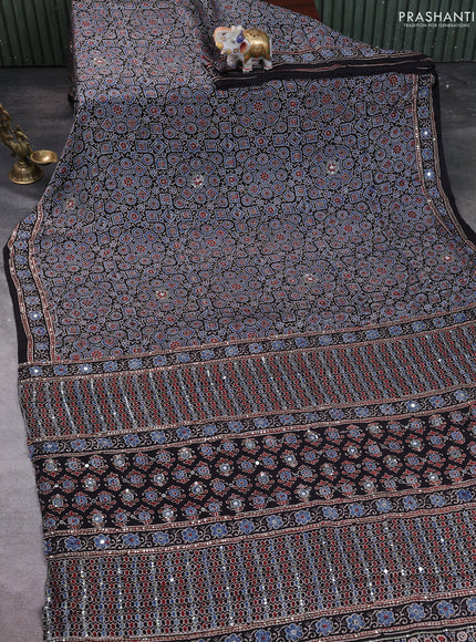 Modal silk saree black with allover ajrakh prints & sequin work and mirror sequin work pallu