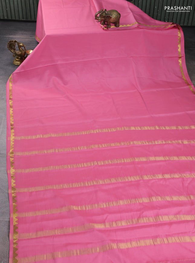 Pure mysore silk saree mild peach pink with plain body and temple zari woven border