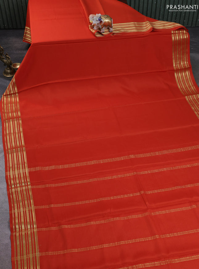 Pure mysore silk saree rustic orange with plain body and zari woven border