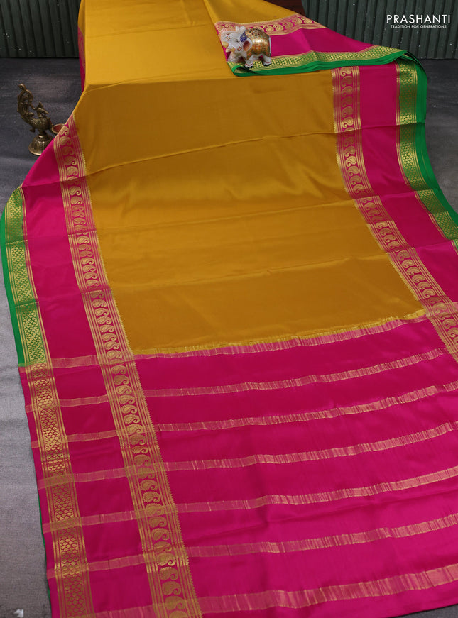 Pure mysore silk saree mustard yellow and pink green with plain body and long rettapet zari woven border