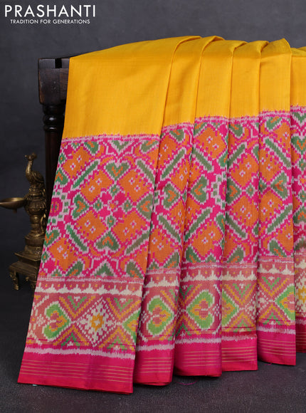Rajkot Patola Silk Saree yellow and pink with plain body and ikat zari woven border