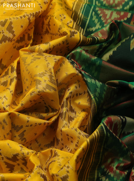 Rajkot Patola Silk Saree mustard yellow and green with allover Ikat weaves and ikat zari woven border