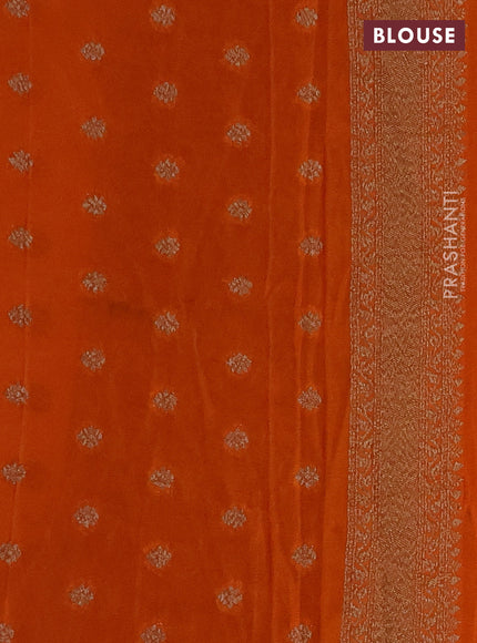 Banarasi Art Georgette Saree peacock blue and orange with woven buttas and woven border