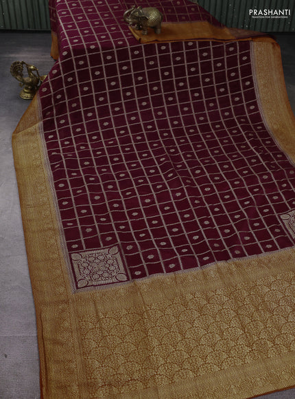 Banarasi Art Georgette Saree wine shade and orange with allover thread & zari checked pattern and woven border