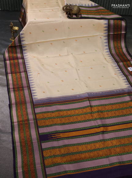 Pure kanchipuram silk saree cream and deep violet with thread woven buttas and temple design thread woven border