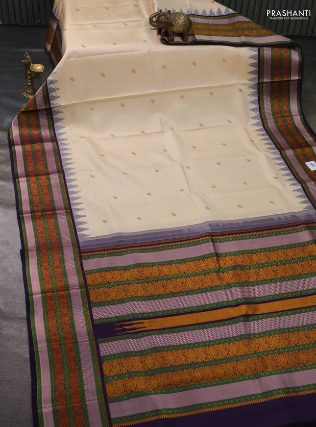 Pure kanchipuram silk saree cream and deep violet with thread woven buttas and temple design thread woven border