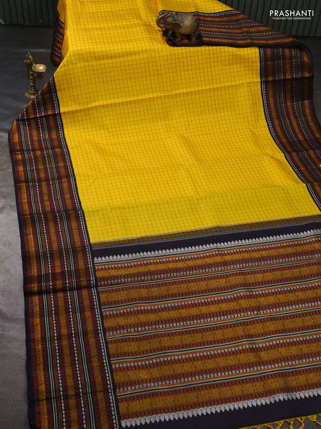 Pure kanchipuram silk saree yellow and black with allover checked pattern and thread woven border