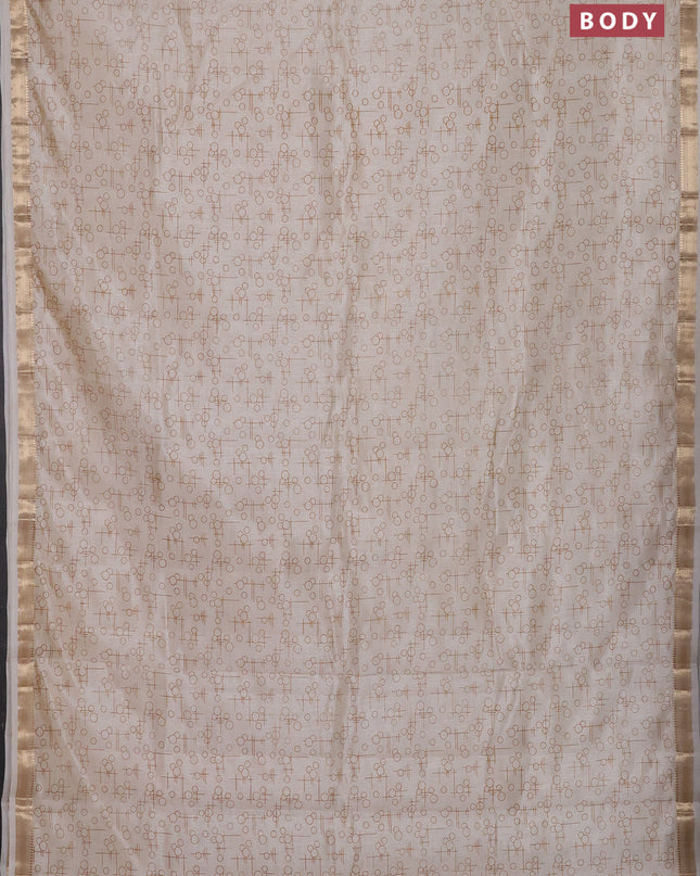 Semi raw silk saree cream with allover geometric prints and zari woven border