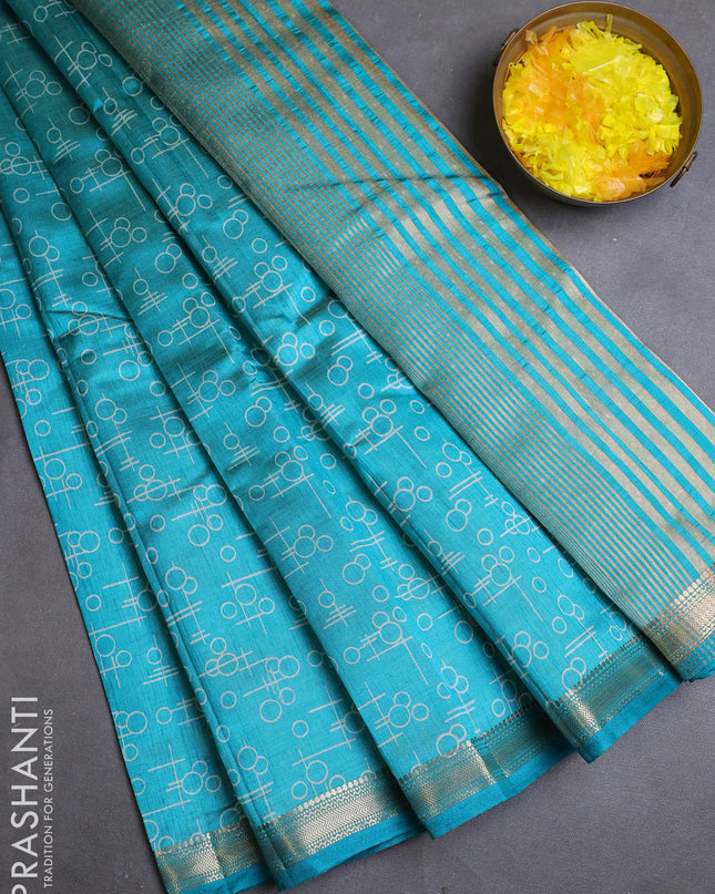 Semi raw silk saree teal blue with allover geometric prints and zari woven border
