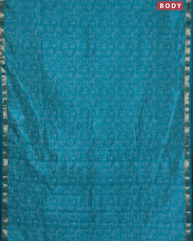 Semi raw silk saree teal blue with allover geometric prints and zari woven border