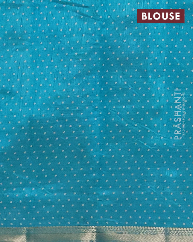 Semi raw silk saree teal blue with allover geometric prints and zari woven border