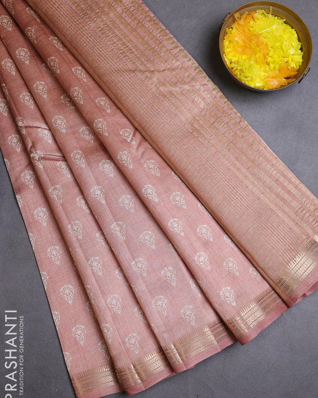 Semi raw silk saree pastel peach with allover butta prints and zari woven border