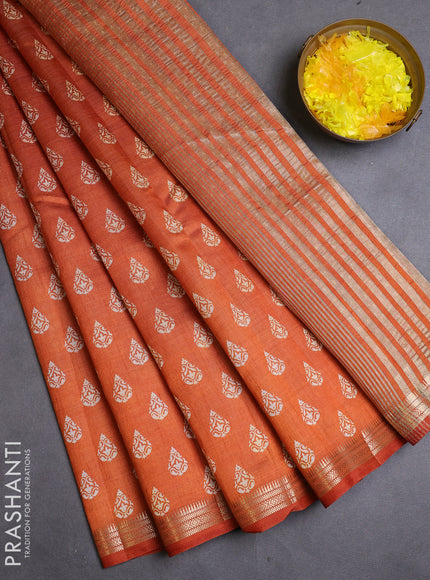 Semi raw silk saree rustic orange with allover butta prints and zari woven border