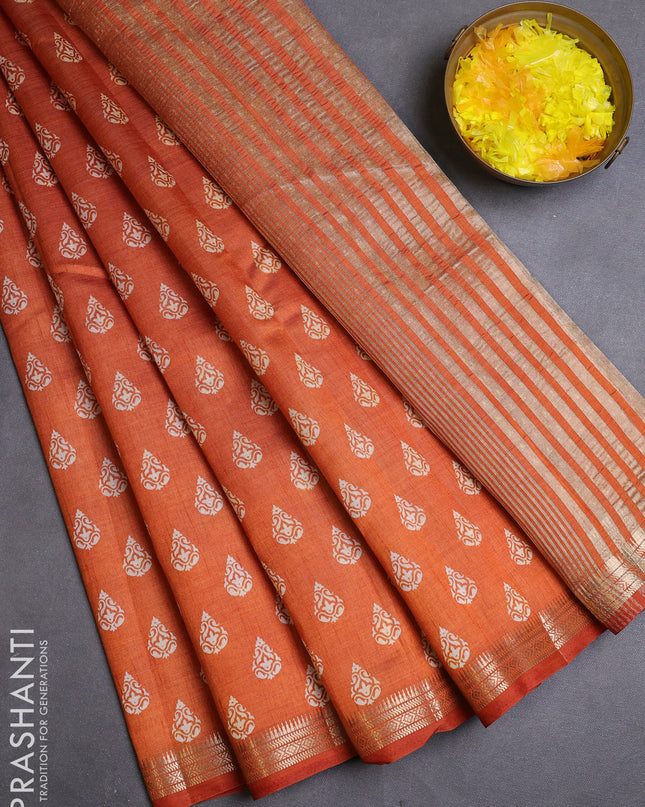 Semi raw silk saree rustic orange with allover butta prints and zari woven border