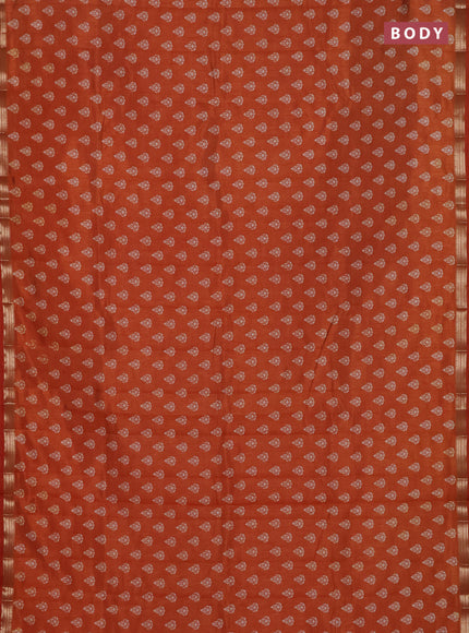 Semi raw silk saree rustic orange with allover butta prints and zari woven border
