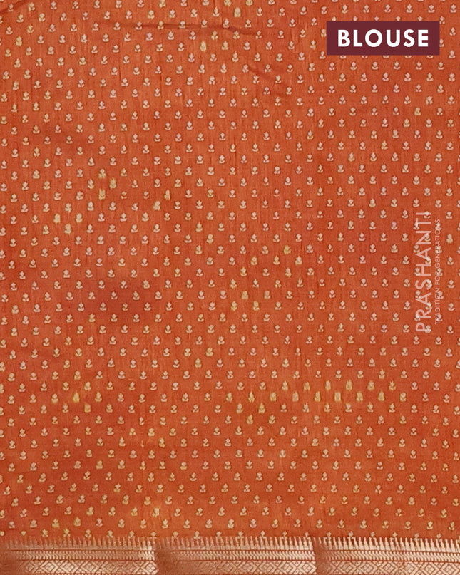 Semi raw silk saree rustic orange with allover butta prints and zari woven border