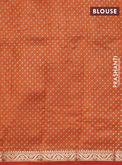 Semi raw silk saree rustic orange with allover geometric prints and zari woven border
