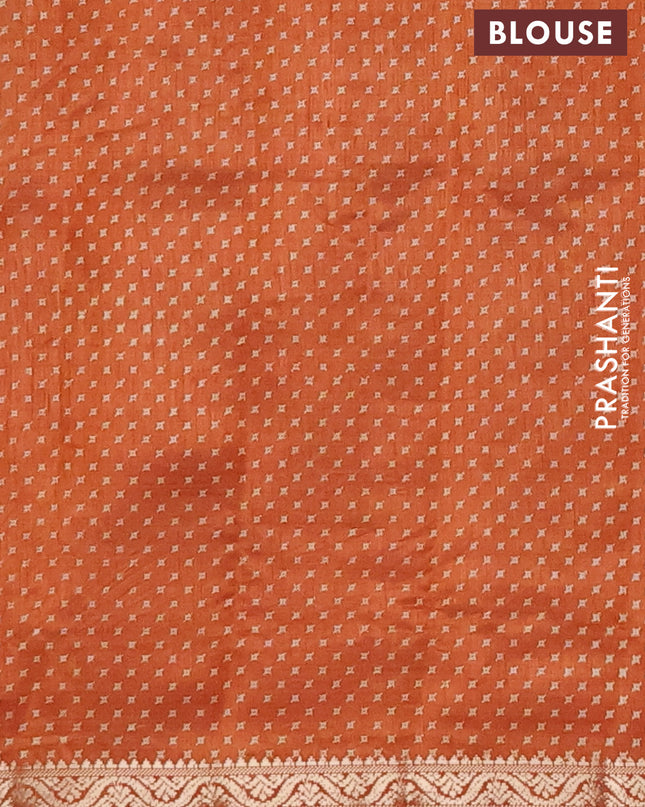 Semi raw silk saree rustic orange with allover geometric prints and zari woven border
