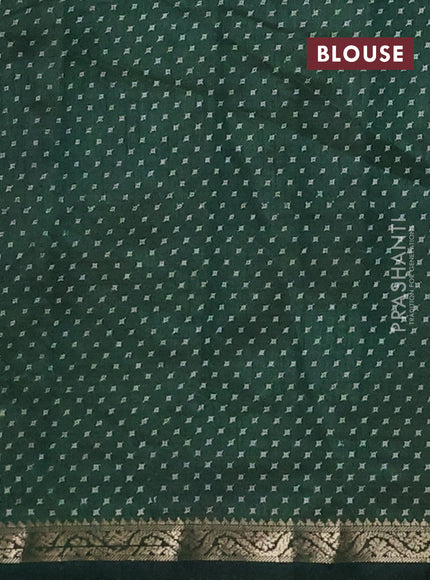 Semi raw silk saree bottle green with allover geometric prints and zari woven border
