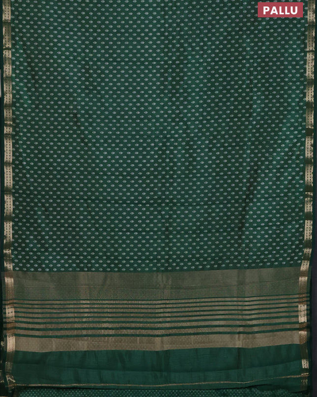 Semi raw silk saree bottle green with allover butta prints and zari woven border